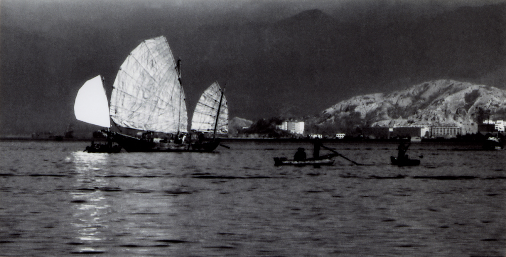 A Kung Ngam in Shau Kei Wan in the old days. The sails were a signature of the fishing waterfront.