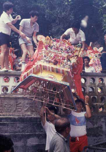 Moving the Flower Cannons after presentation at the temple